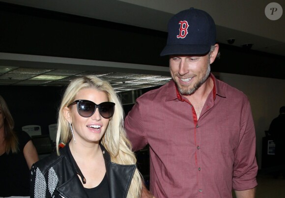 Jessica Simpson et Eric Johnson à l'aéroport LAX de Los Angeles. Le 5 mai 2014.