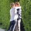 Exclusif - Charlize Theron embrasse son compagnon Sean Penn avant de quitter son domicile avec son fils Jackson à Los Angeles, le 17 mai 2014