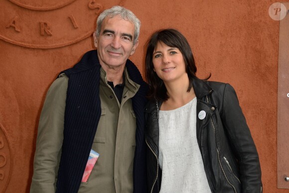Raymond Domenech et Estelle Denis au Village Roland-Garros à Paris, le 27 mai 2014.
