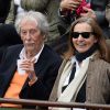 Jean Rochefort et sa femme Françoise Vidal lors des Internationaux de France à Roland-Garros à Paris, le 29 mai 2014