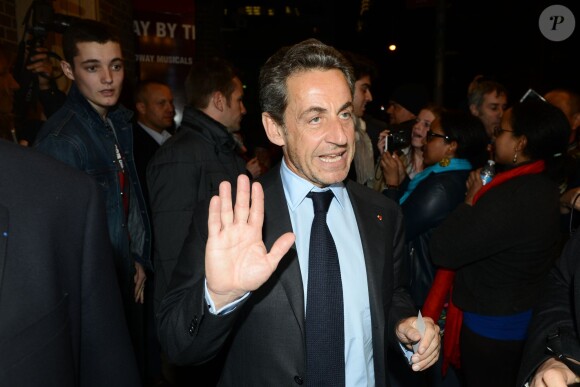 Nicolas Sarkozy et Carla Bruni sortant du Town Hall après le concert de madame à New York, le 24 avril 2014.