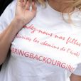  Le t-shirt Bring Back Our Girls (en référence à l'enlèvement de 273 lycéennes au Nigéria) porté par Valérie Trierweiler lors du défilé haute couture Christian Dior automne-hiver 2014-15. Paris, le 7 juillet 2014. 