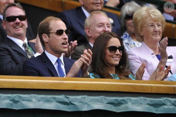 Le prince William et son épouse Catherine dans la Royal Box du Centre Court de Wimbledon, le 6 juillet 2014, lors de la finale entre Novak Djokovic et Roger Federer