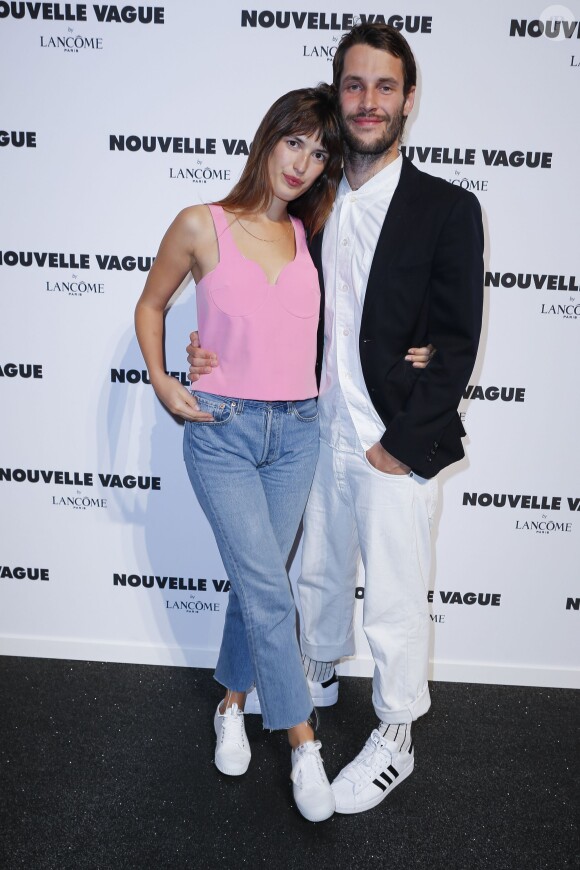 Jeanne Damas et Simon Porte Jacquemus lors de la soirée "Nouvelle Vague by Lancôme" au Palais Brogniart à Paris, le 9 juillet 2014.