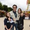 Anthony Delon avec ses filles Liv et Lou - Inauguration de la fête foraine des Tuileries à Paris le 28 juin 2013.
