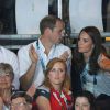 Kate Middleton, le prince William et le prince Harry en tribunes lors d'un match de boxe aux XXe Jeux du Commonwealth, le 28 juillet 2014 à Glasgow.