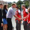 Le prince William, Kate Middleton et le prince Harry ont rencontré des membres du staff à Hampden Park lors des XXe Jeux du Commonwealth à Glasgow, le 29 juillet 2014.