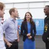 Le prince William, Kate Middleton et le prince Harry ont rencontré Usain Bolt lors de leur visite au village des XXe Jeux du Commonwealth à Glasgow, le 29 juillet 2014.