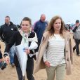 Valérie Trierweiler, les partenaires du Secours Populaire et le maire de Ouistreham, Romain Bail, donnent une conférence de presse lors de la "Journée des oubliés des vacances" sur la plage de Ouistreham, le 20 août 2014.