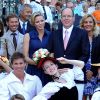 La princesse Charlene de Monaco, enceinte de six mois, et le prince Albert II de Monaco ont participé le 1er septembre 2014 au traditionnel pique-nique des Monégasques, organisé au parc Princesse-Antoinette par la mairie.