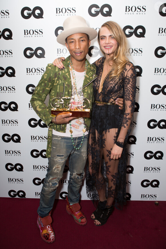 Cara Delevingne et Pharrell Williams lors de la soirée GQ Men of the Year Awards 2014 à Londres, le 2 septembre 2014.