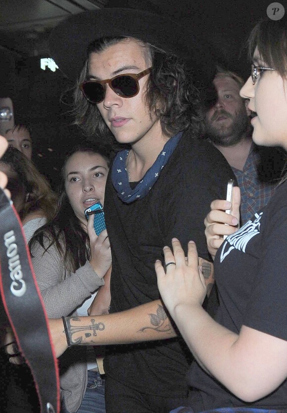 Le chanteur Harry Styles à son arrivée à l'aéroport de Los Angeles, le 5 septembre 2014.