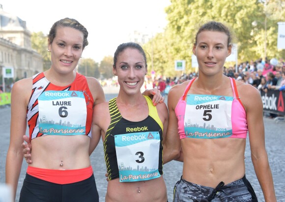 Laure Funten (3ème), Sarah Crouch (1ère) et Ophélie Claude-Boxberger (2ème) durant la course La Parisienne 2014 pour la lutte contre le cancer, au Champs de Mars à Paris, le 14 septembre 2014