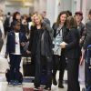 Madonna avec ses enfants Rocco, David et Mercy à leur retour de vacances à l'aéroport JFK de New York le 27 août 2014
