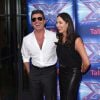 Simon Cowell et sa compagne Lauren Silverman lors du lancement de l'émission "The X Factor" au Ham Yard Hotel à Londres, le 27 août 2014.