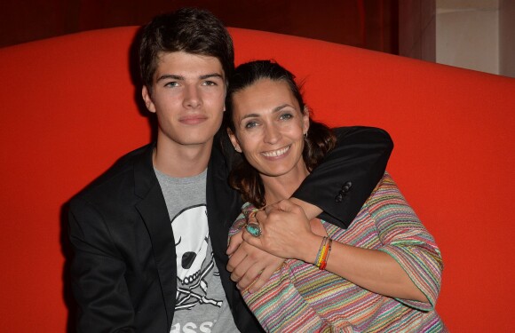 Adeline Blondieau et son fils Aïtor, 15 ans, dans l'espace VIP lors de la soirée de lancement FIFA 15 à l'Opéra Restaurant au Palais Garnier, le 22 septembre 2014 à Paris.