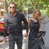 Sam Worthington et sa compagne Lara Bingle arrivant à leur hôtel à New York. Lara tente de cacher son baby bump, le 20 septembre 2014