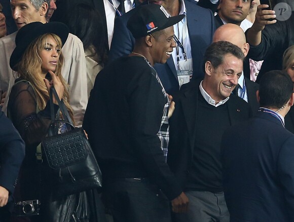 Beyoncé et Jay Z se marrent avec Nicolas Sarkozy - Match PSG-Barcelone de la Ligue des Champions au parc des princes à Paris le 30 septembre 2014. Le PSG à remporté le match sur le score de 3-2.