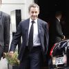 Nicolas Sarkozy et sa femme Carla Bruni-Sarkozy sortent du restaurant Hanawa après leur déjeuner à Paris, le 2 octobre 2014.