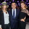 Anne Parillaud, Carlos Ghosn et Clotilde Courau lors de la soirée d'inauguration des nouvelles Renault Espace et Clio lors du salon de l'automobile au Parc des Expositions de la porte de Versailles à Paris, le 2 octobre 2014.