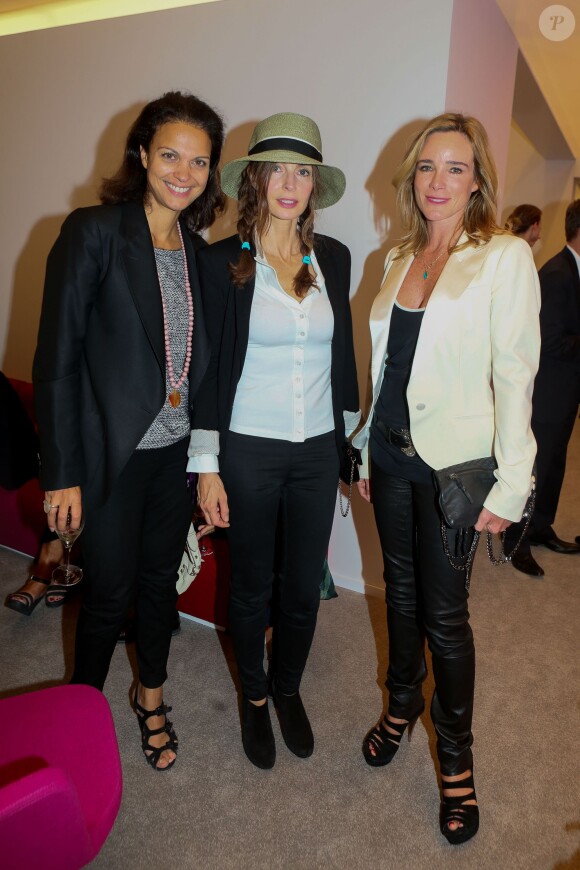 Isabelle Giordano, Anne Parillaud et Géraldine Danon lors de la soirée d'inauguration des nouvelles Renault Espace et Clio lors du salon de l'automobile au Parc des Expositions de la porte de Versailles à Paris, le 2 octobre 2014.