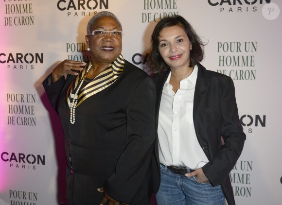 Firmine Richard et Saïda Jawad lors de la soirée des 80 ans du parfum Pour Un Homme de Caron, au Théâtre du Renard, à Paris, le 9 octobre 2014.