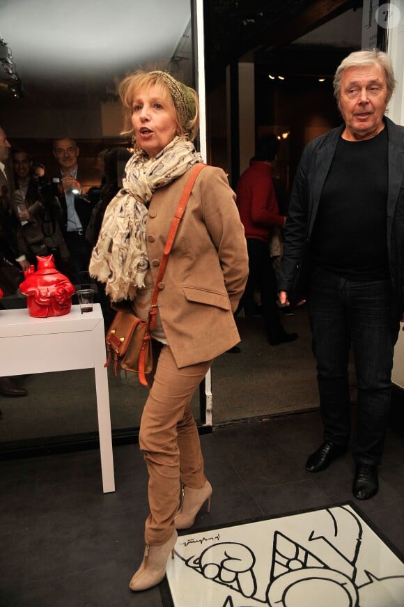 Catherine Barma et son mari Philippe Lefebvre - Vernissage de l'exposition "Tout L'Art Du Chat" de Philippe Geluck à la galerie Huberty-Breyne à Paris, le 14 octobre 2014.