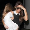 Victoria Beckham arrive avec ses enfants Romeo, Cruz, et Harper à Los Angeles le 16 octobre 2014.