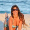 Claudia Romani profite du soleil sur une plage de Miami. Le 26 octobre 2014.