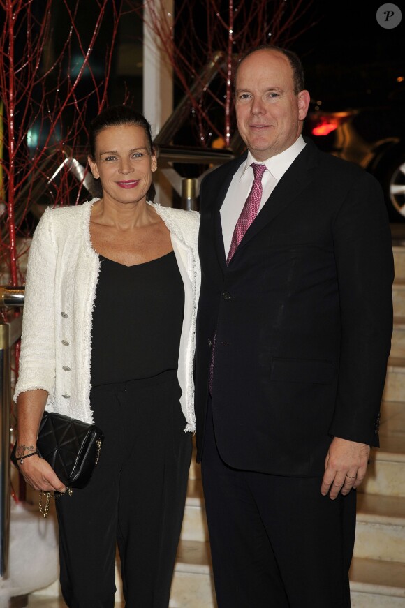 La princesse Stéphanie de Monaco, présidente de Fight Aids Monaco et ambassadrice de l'ONU Sida, et son frère le prince Albert II de Monaco participent à la traditionnelle vente aux enchères organisée par Fight Aids Monaco le 1er décembre 2014 à Monaco.