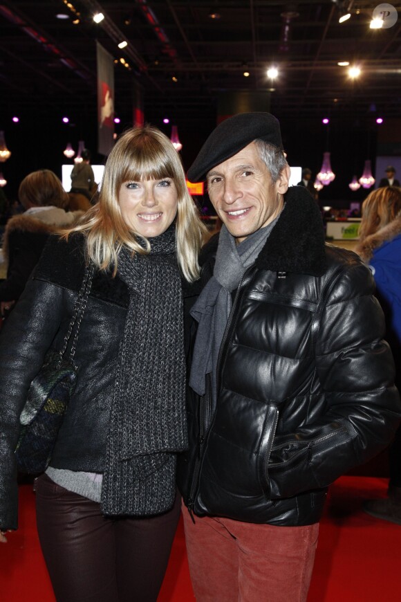 Nagui et sa femme Mélanie Page - Dans le cadre du Gucci Paris Masters a eu lieu l'epreuve "Style & Competition for AMADE" à Villepinte le 7 décembre 2013.
