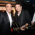 Nikos Aliagas et Patrick Bruel, dans les coulisses des NRJ Music Awards 2014 à Cannes, le samedi 13 décembre 2014.