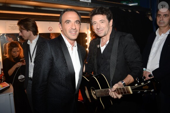 Nikos Aliagas et Patrick Bruel, dans les coulisses des NRJ Music Awards 2014 à Cannes, le samedi 13 décembre 2014.