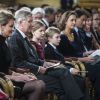 Le roi Philippe et la reine Mathilde de Belgique assistaient le 17 décembre 2014, avec leurs enfants Elisabeth, Gabriel, Emmanuel et Eléonore, au traditionnel concert de Noël, au palais royal, dédié à la mémoire de la défunte reine Fabiola.