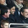 Manuel Valls, Nasser Al-Khelaïfi, Nicolas Sarkozy au match PSG-Montpellier lors de la 19e journée de Ligue 1 au Parc des Princes, le 20 décembre 2014.