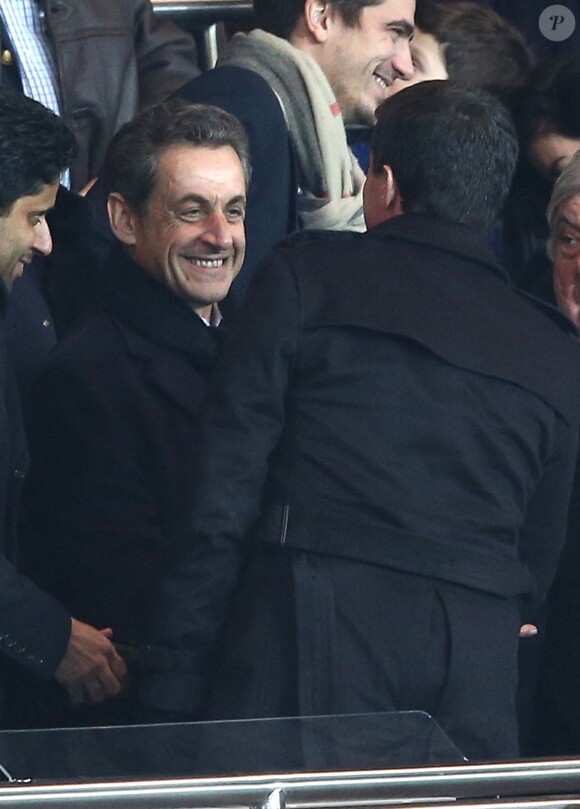 Manuel Valls, Nicolas Sarkozy au match PSG-Montpellier lors de la 19e journée de Ligue 1 au Parc des Princes, le 20 décembre 2014.