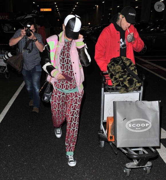 Rita Ora et son compagnon Ricky Hilfiger de retour à l'aéroport de Londres après avoir passé des vacances dans les Caraïbes Le 3 janvier 2015 