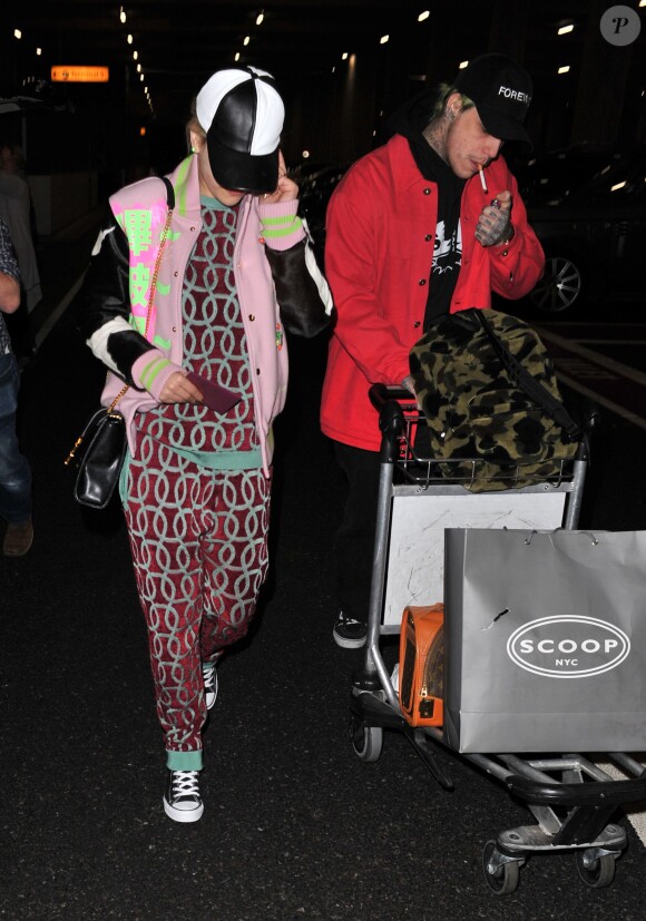 Rita Ora et son compagnon Ricky Hilfiger de retour à l'aéroport de Londres après avoir passé des vacances dans les Caraïbes. Le 3 janvier 2015  