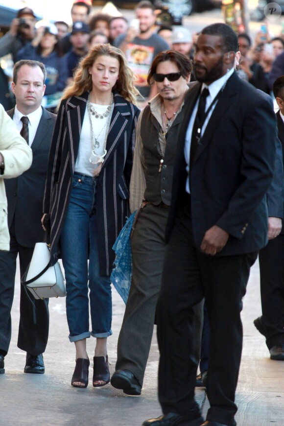 Johnny Depp et Amber Heard arrivent main dans la main au El Capitan Theatre pour le Jimmy Kimmel Live, Hollywood, Los Angeles, le 15 janvier 2015.