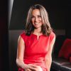 Pippa Middleton posant en 2014 dans une robe LK Bennett en tant qu'ambasssadrice de la British Heart Foundation.