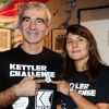 Raymond Domenech et sa compagne Estelle Denis lors du Kettler Challenge au profit de l'association "L'étoile de Martin" à l'hôtel Molitor à Paris, le 1er décembre 2014