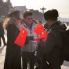 Exclusif - Vibcent Niclo et Arielle Dombasle portant une casquette d'officier de l'Armée Rouge pour rendre hommage au sublime ballet de l'Armée Rouge sur la place Tian'anmen. À Pékin, le 27 janvier 2015.