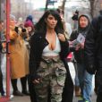 Kim Kardashian visited a few retail stores in Soho this afternoon in New York City, NY, USA on February 09, 2015. The reality TV star, who attended the 57th Annual Grammy Awards with hubby West last night, wore a tiny white top showing off a lot of cleavage, a black maxi cardigan and camo baggy trousers matching her olive green lace up booties. Photo by GSI/ABACAPRESS.COM10/02/2015 - New York City