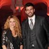 La chanteuse Shakira, enceinte, et Gerard Piqué lors des 100 ans de la marque Puig à Barcelone le 22 octobre 2014.