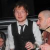 Ed Sheeran et sa compagne Athina Andrelos, des verres plein les mains, arrivent à l'after-party des Brit Awards organisé par Warner Music, à Londres le 25 février 2015.