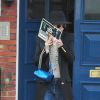 Rita Ora quitte son domicile, suivie de son petit ami Richard Hillfiger. Londres, le 17 mars 2015.