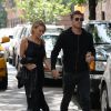 Sam Worthington et Lara Bingle arrivent à leur hôtel à New York. Lara porte une robe avec un décolleté sexy. Le 20 septembre 2014  Couple Sam Worthington and Lara Bingle seen arriving at their hotel in New York City, New York on September 20, 2014. Rumors are swirling that the couple is expecting their first child together and it looks like Lara is trying to hide her stomach behind a black leather jacket.20/09/2014 - New York