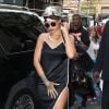 Rihanna arrive à l'hôtel The Carlyle à New York, habillée d'une robe Adam Selman et de baskets Puma. Un foulard noué sur la tête, des lunettes Le Specs et un sac Louis Vuitton accessoirisent sa tenue pré-Met Gala. Le 4 ami 2015.