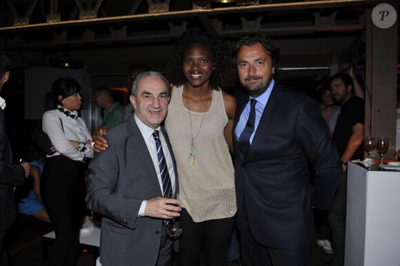Jean Gachassin, Muriel Hurtis et Henri Leconte lors de la soirée des joueurs de Roland-Garros au premier étage de la Tour Eiffel, à Paris le 21 mai 2015