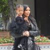 Kim Kardashian et Kourtney Kardashian emmènent leurs filles North et Penelope à leur cours de danse à Tarzana. La petite North est habillée comme sa maman. Le 21 mai 2015  